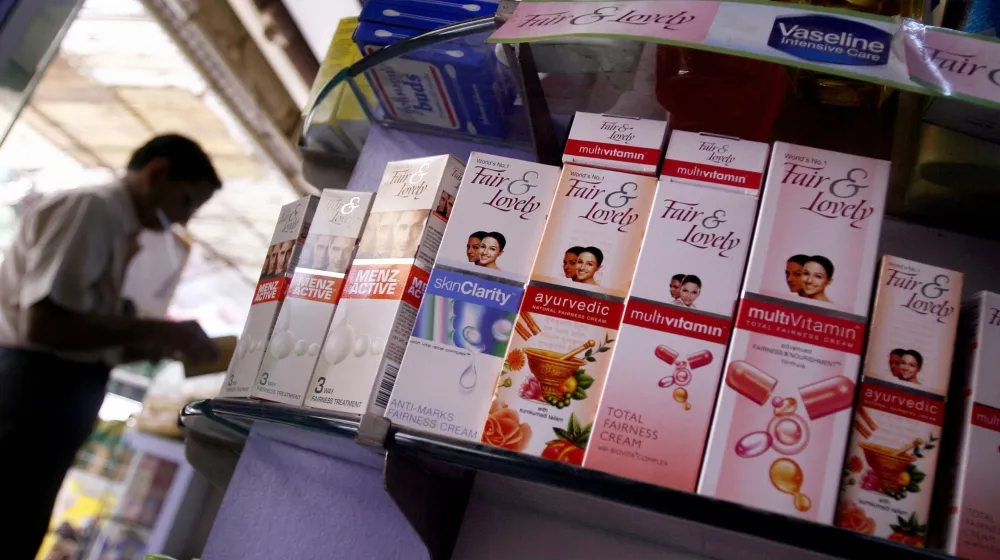 Display of various Fair & Lovely products in a shop, highlighting the brand's skin-lightening cosmetics.