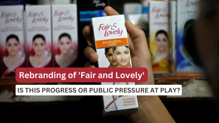 Close-up of a hand holding a box of Fair & Lovely Ayurvedic Care cream in a store, with multiple similar products displayed in the background.